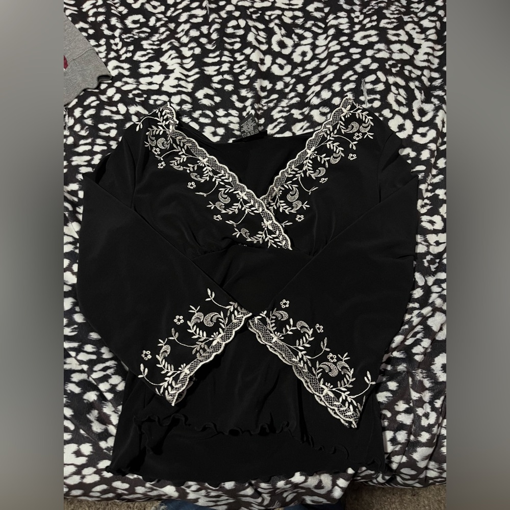 Chic Black Blouse with White Floral Detailing
